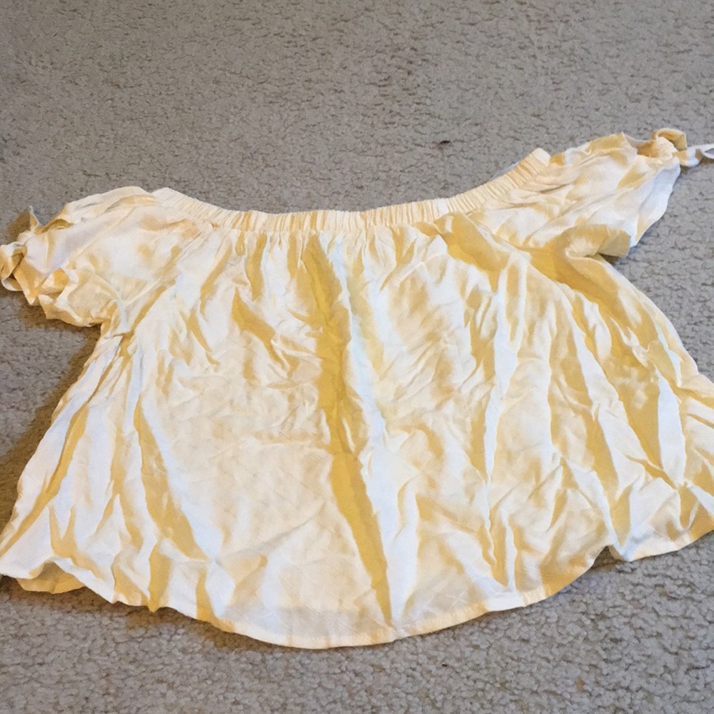 Light yellow off the shoulder shirt